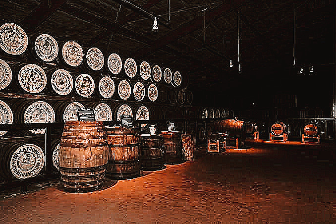 Rows of wooden casks aging whisky in Miyagikyo Distillery’s warehouse.