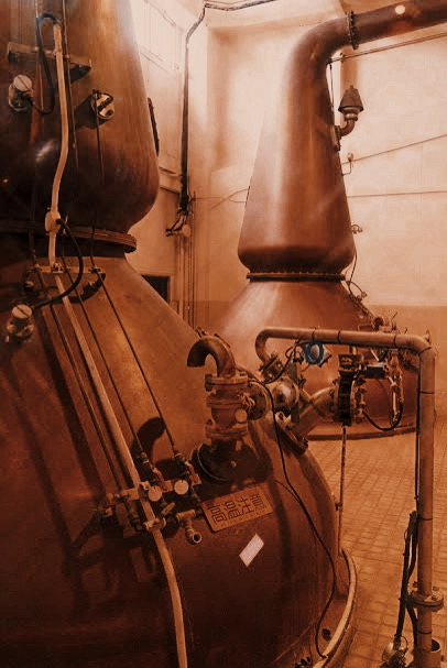  The stills at Kirin Gotemba Distillery, highlighting their role in the whisky distillation process.