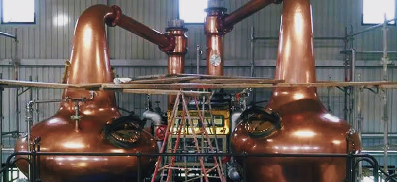 Chichibu Distillery’s copper stills used in the production of premium Japanese whisky, highlighting traditional craftsmanship and innovative techniques.