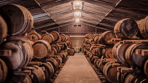 Aging casks at Chichibu Distillery, emphasizing the use of various wood types for aging their premium whisky.