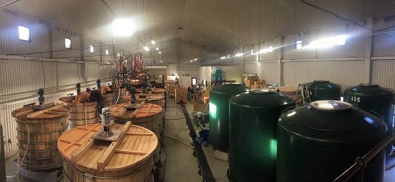 Aging casks at Chichibu Distillery, emphasizing the use of various wood types for aging their premium whisky.