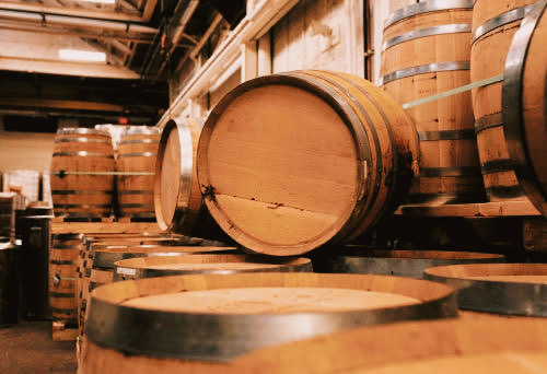 Aging casks at Chichibu Distillery, emphasizing the use of various wood types for aging their premium whisky.