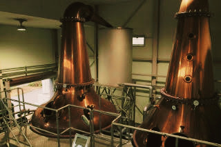 Copper pot stills at Mars Iwai Distillery, essential for crafting refined whisky.