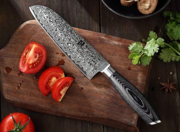 Handcrafted Japanese kitchen knife made from high-carbon steel, featuring razor-sharp precision and a traditional Japanese design, perfect for professional chefs and home cooking.