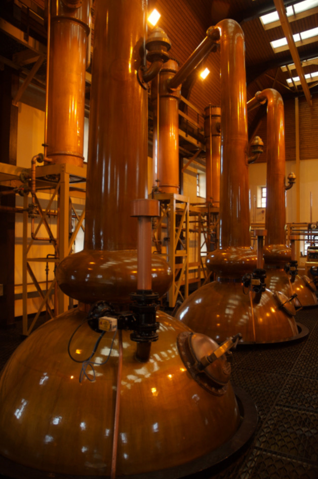 Traditional Japanese whisky distillery with barrels and misty mountains – Yamazaki, Nikka, Chichibu